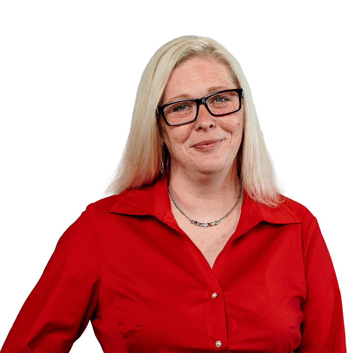 Smiling woman with blonde hair and black glasses wearing a red button-down shirt.