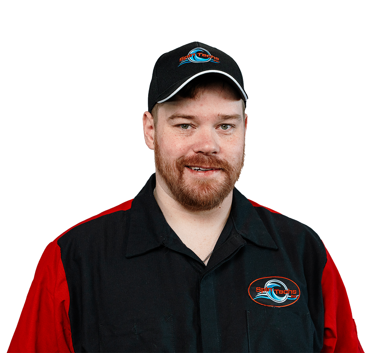 Portrait of a man in a black and red SpinTechs uniform cap, smiling at camera with logo visible on shirt and cap